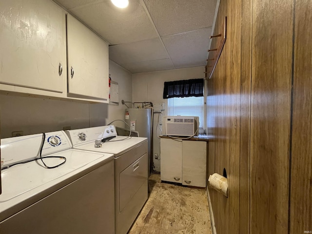 2405 Clara Ave, Fort Wayne, IN 46805 - washroom featuring washing machine and dryer, cabinet space, electric water heater, and cooling unit