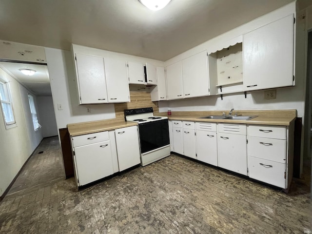 2405 Clara Ave, Fort Wayne, IN 46805 - kitchen featuring electric stove, a sink, white cabinetry, light countertops, and under cabinet range hood