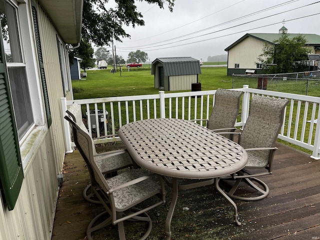 39 E Linn Rd, Bluffton, IN 46714 - wooden terrace with a shed, a lawn, and outdoor dining space