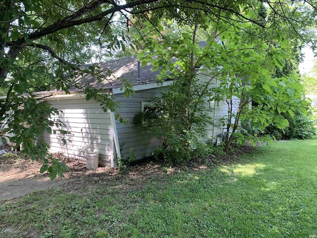 1316 N Factory St, Fairmount, IN 46928 - view of side of home featuring a shingled roof and a lawn