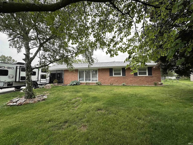 4340 Midway Rd, Elkhart, IN 46517 - ranch-style home featuring brick siding and a front yard