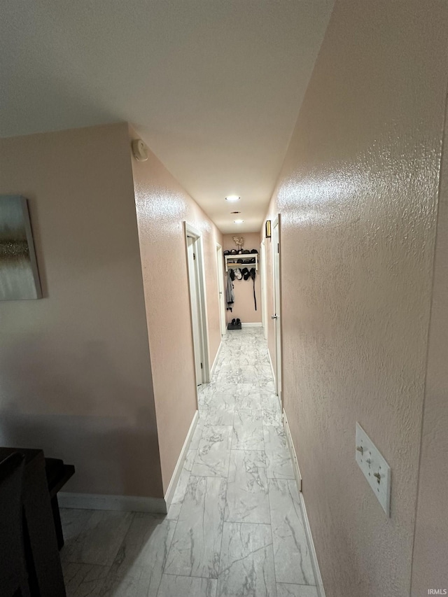 4340 Midway Rd, Elkhart, IN 46517 - hallway with light marble finish floors, baseboards, and a textured wall