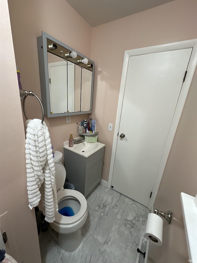 4340 Midway Rd, Elkhart, IN 46517 - bathroom featuring marble look tiles, toilet, and vanity
