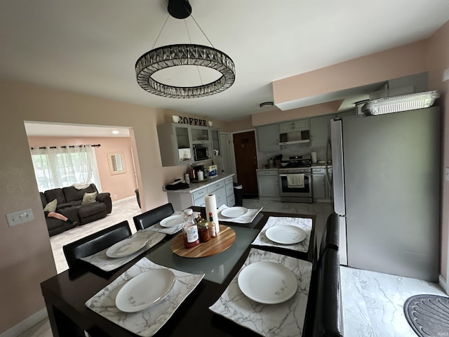 4340 Midway Rd, Elkhart, IN 46517 - dining area with baseboards and light marble finish floors