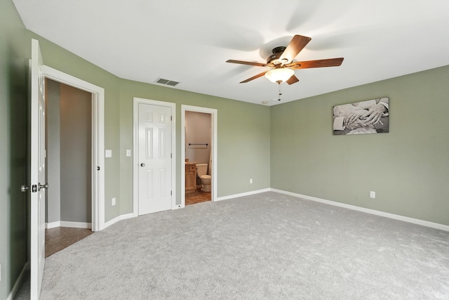 1328 Monte Carlo Dr, Huntertown, IN 46748 - unfurnished bedroom featuring carpet floors, baseboards, a ceiling fan, and ensuite bathroom