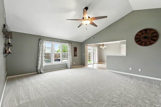 1328 Monte Carlo Dr, Huntertown, IN 46748 - carpeted spare room with a chandelier, a ceiling fan, baseboards, and high vaulted ceiling
