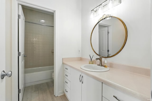 113 W Wayne St Unit 311, Fort Wayne, IN 46802 - full bath featuring vanity, toilet, wood finished floors, and tub / shower combination