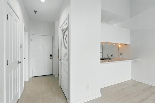 113 W Wayne St Unit 311, Fort Wayne, IN 46802 - hall with baseboards and a sink