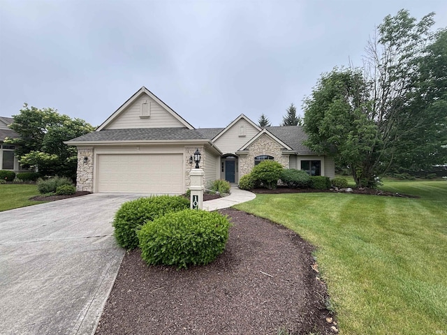 10403 Maple Springs Cv, Fort Wayne, IN 46845 - view of front of home with a front lawn, concrete driveway, an attached garage, and roof with shingles