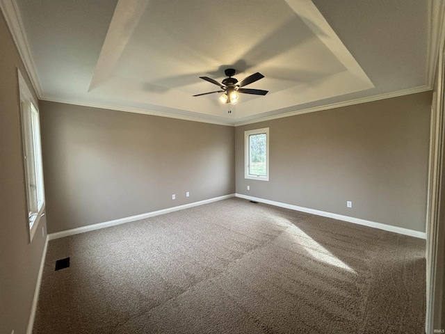 10403 Maple Springs Cv, Fort Wayne, IN 46845 - unfurnished room with a tray ceiling, a ceiling fan, baseboards, dark carpet, and crown molding