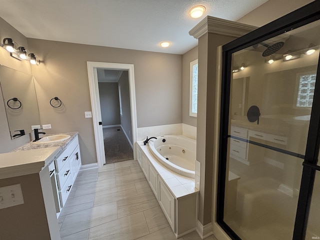 10403 Maple Springs Cv, Fort Wayne, IN 46845 - bathroom with a stall shower, a tub with jets, double vanity, and baseboards