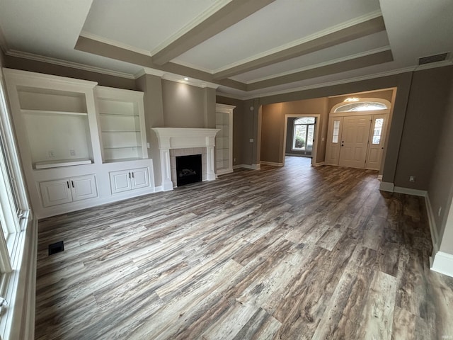 10403 Maple Springs Cv, Fort Wayne, IN 46845 - unfurnished living room featuring wood finished floors, a tiled fireplace, ornamental molding, and baseboards