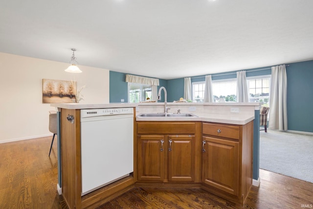 515 Cloudmont Dr, Osceola, IN 46561 - kitchen featuring white dishwasher, a sink, light countertops, brown cabinetry, and decorative light fixtures