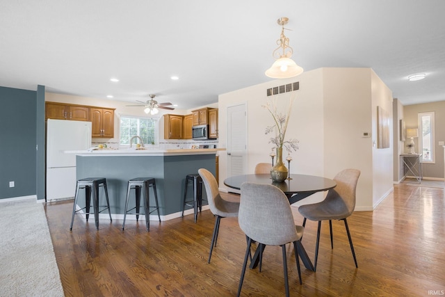 515 Cloudmont Dr, Osceola, IN 46561 - dining room with baseboards, dark wood-style flooring, recessed lighting, and ceiling fan