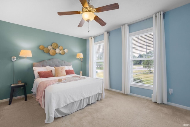 515 Cloudmont Dr, Osceola, IN 46561 - carpeted bedroom featuring multiple windows, baseboards, and a ceiling fan