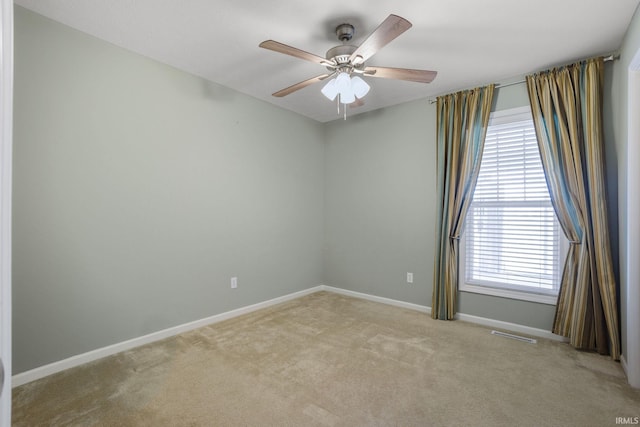 515 Cloudmont Dr, Osceola, IN 46561 - unfurnished room with light colored carpet, a ceiling fan, and baseboards