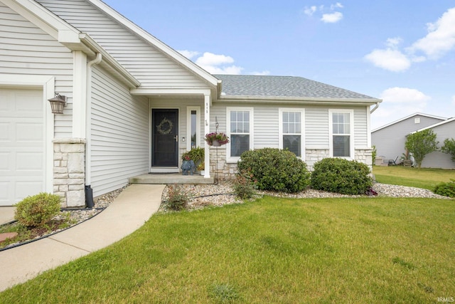 515 Cloudmont Dr, Osceola, IN 46561 - view of front facade with a front lawn, stone siding, a shingled roof, and an attached garage
