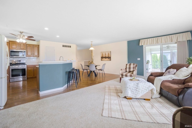 515 Cloudmont Dr, Osceola, IN 46561 - living area with carpet floors, recessed lighting, baseboards, and wood finished floors