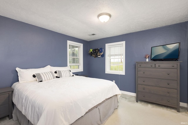 53722 Bittersweet Rd, Mishawaka, IN 46545 - bedroom featuring a textured ceiling, light colored carpet, and baseboards