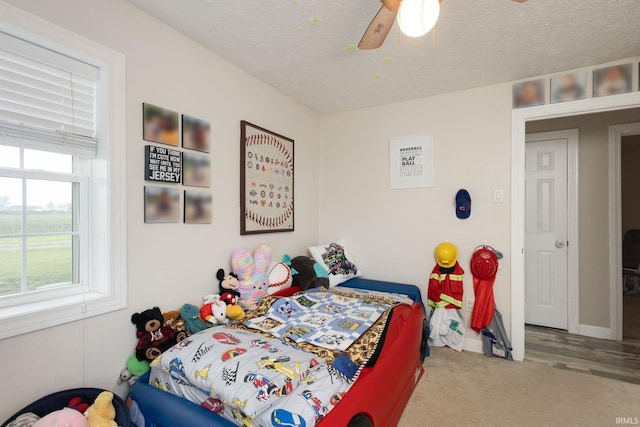 53722 Bittersweet Rd, Mishawaka, IN 46545 - carpeted bedroom with a ceiling fan and a textured ceiling