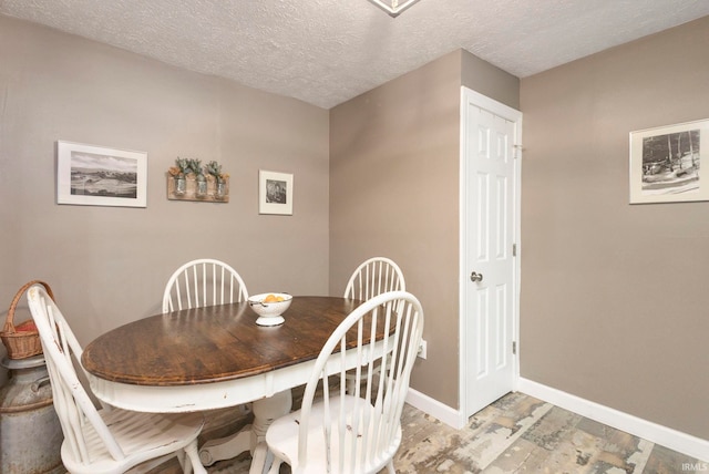 53722 Bittersweet Rd, Mishawaka, IN 46545 - dining room featuring baseboards and a textured ceiling