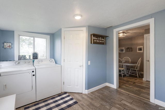 53722 Bittersweet Rd, Mishawaka, IN 46545 - laundry room with separate washer and dryer, wood finished floors, and baseboards