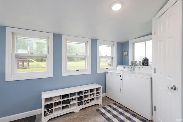 53722 Bittersweet Rd, Mishawaka, IN 46545 - washroom with washing machine and dryer, baseboards, and healthy amount of natural light