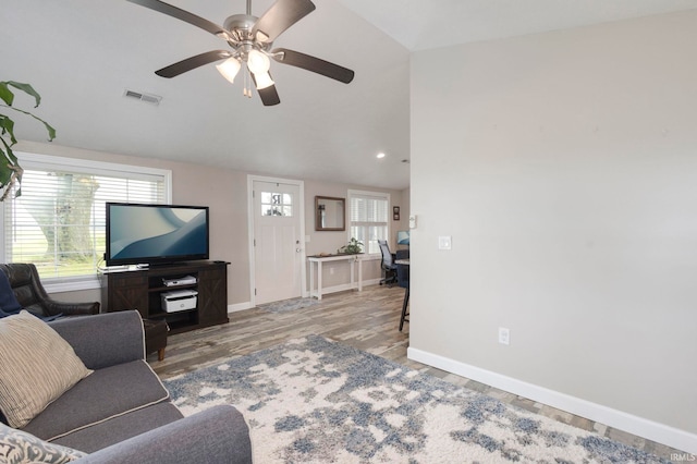 53722 Bittersweet Rd, Mishawaka, IN 46545 - living area featuring vaulted ceiling, wood finished floors, baseboards, ceiling fan, and an office area