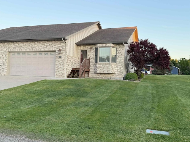 530 W 060 N, Lagrange, IN 46761 - ranch-style home featuring a front yard, an attached garage, driveway, and brick siding