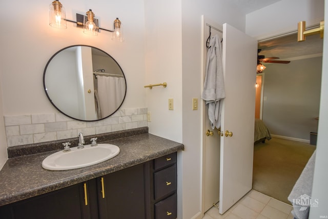 2318 W Concord Rd, Muncie, IN 47304 - bathroom featuring vanity, a ceiling fan, tasteful backsplash, tile patterned flooring, and baseboards