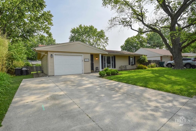 2318 W Concord Rd, Muncie, IN 47304 - ranch-style house featuring an attached garage, concrete driveway, and central AC