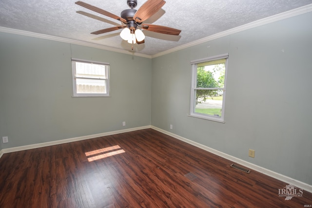 2318 W Concord Rd, Muncie, IN 47304 - spare room with healthy amount of natural light, a textured ceiling, wood finished floors, baseboards, and ornamental molding