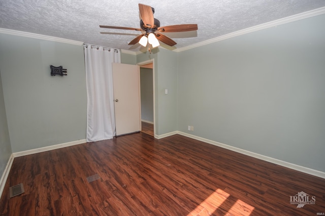 2318 W Concord Rd, Muncie, IN 47304 - spare room featuring a textured ceiling, dark wood-style floors, baseboards, a ceiling fan, and crown molding