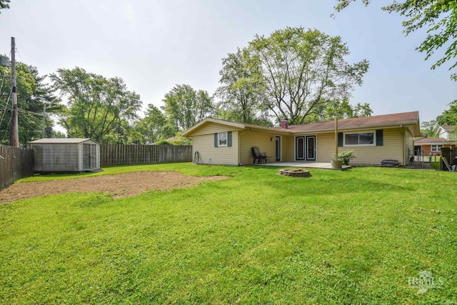 2318 W Concord Rd, Muncie, IN 47304 - view of yard featuring a fire pit and a patio area