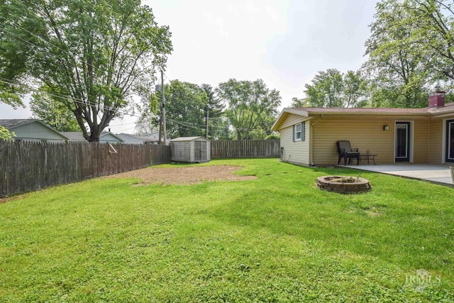 2318 W Concord Rd, Muncie, IN 47304 - view of yard featuring a fire pit and a patio area