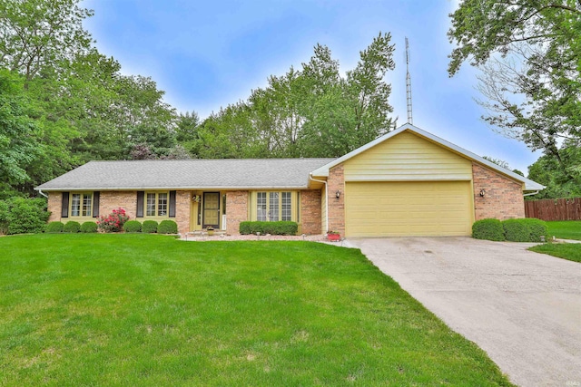1402 Ivy Ct, North Manchester, IN 46962 - ranch-style house with an attached garage, brick siding, and concrete driveway