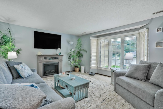 1402 Ivy Ct, North Manchester, IN 46962 - carpeted living room with a textured ceiling and a fireplace