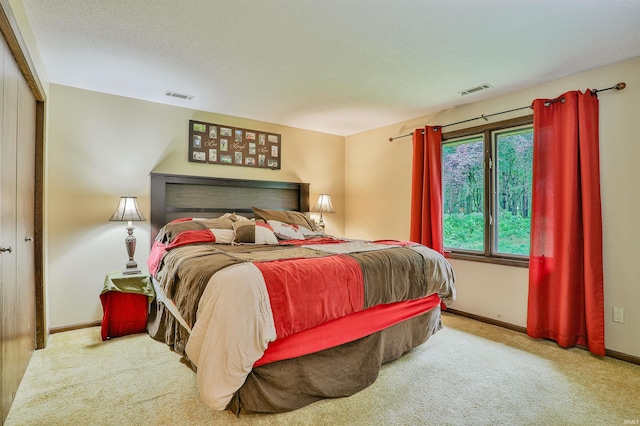 1402 Ivy Ct, North Manchester, IN 46962 - bedroom with carpet, baseboards, and a textured ceiling