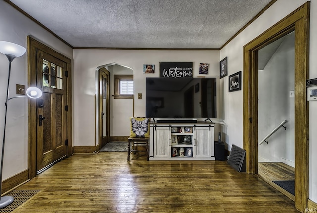 4321 Arlington Ave, Fort Wayne, IN 46807 - living area featuring arched walkways, a textured ceiling, dark wood-style flooring, crown molding, and baseboards
