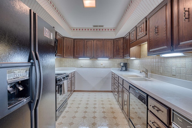 6888 Miller Ln, Newburgh, IN 47630 - kitchen featuring black appliances, a sink, light countertops, light flooring, and decorative backsplash