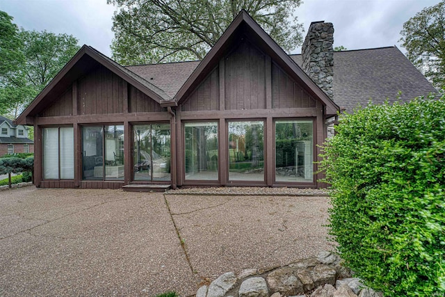 6888 Miller Ln, Newburgh, IN 47630 - rear view of property with a chimney, roof with shingles, a sunroom, and a patio area