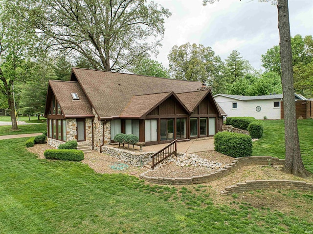 6888 Miller Ln, Newburgh, IN 47630 - back of property with a shingled roof, stone siding, and a yard