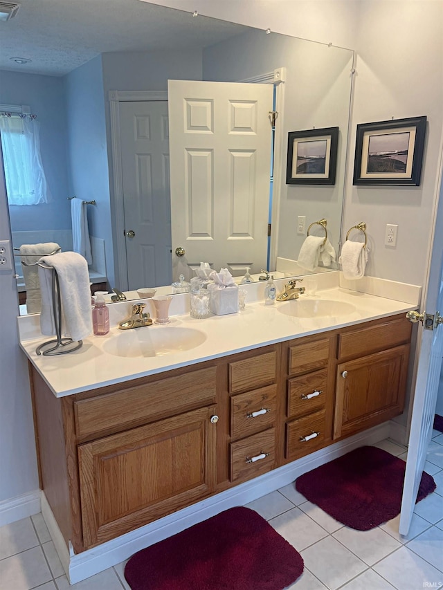 1976 Oak St, Linton, IN 47441 - full bathroom with double vanity, tile patterned floors, and baseboards