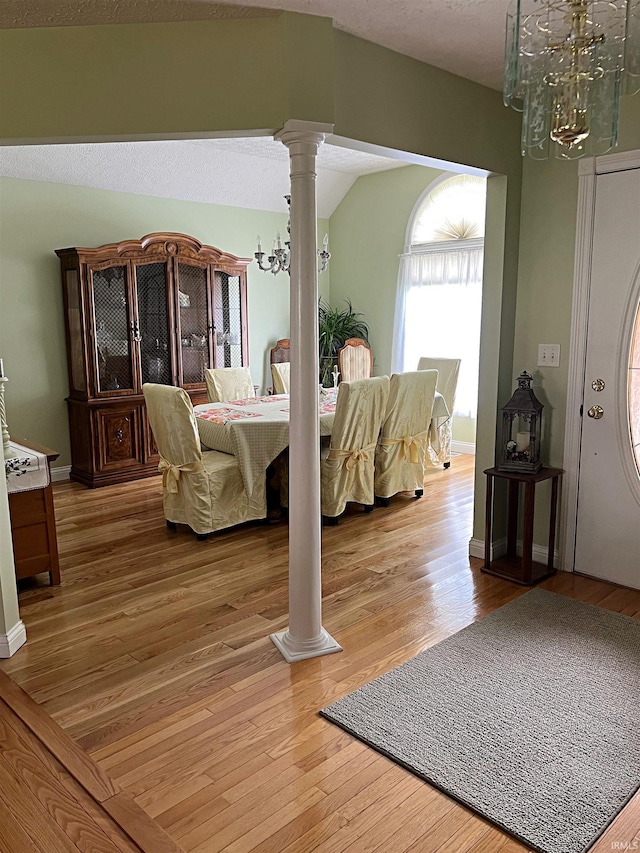1976 Oak St, Linton, IN 47441 - bedroom featuring a chandelier, light wood finished floors, and decorative columns