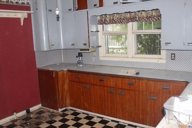 135 S Broad St, Dunkirk, IN 47336 - kitchen featuring dark flooring, tasteful backsplash, and light countertops