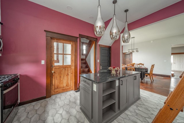 201 S 11th St, New Castle, IN 47362 - kitchen with gas stove, open shelves, a kitchen island, hanging light fixtures, and baseboards