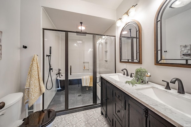 201 S 11th St, New Castle, IN 47362 - full bathroom featuring speckle patterned floor, double vanity, a shower stall, and toilet