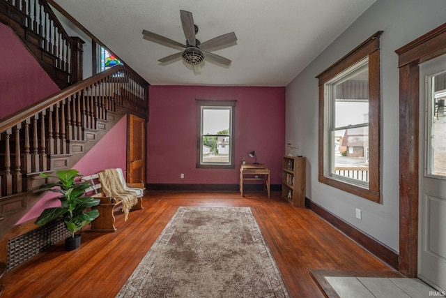201 S 11th St, New Castle, IN 47362 - sitting room featuring wood finished floors, stairway, ceiling fan, and baseboards