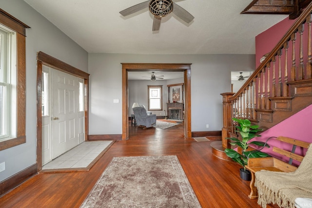 201 S 11th St, New Castle, IN 47362 - entrance foyer featuring a ceiling fan, baseboards, stairway, and wood finished floors