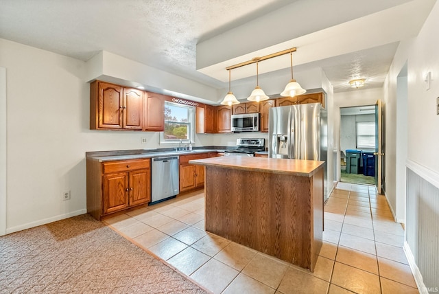 722 Biscayne Ave, Warsaw, IN 46580 - kitchen featuring stainless steel appliances, brown cabinets, and light tile patterned floors